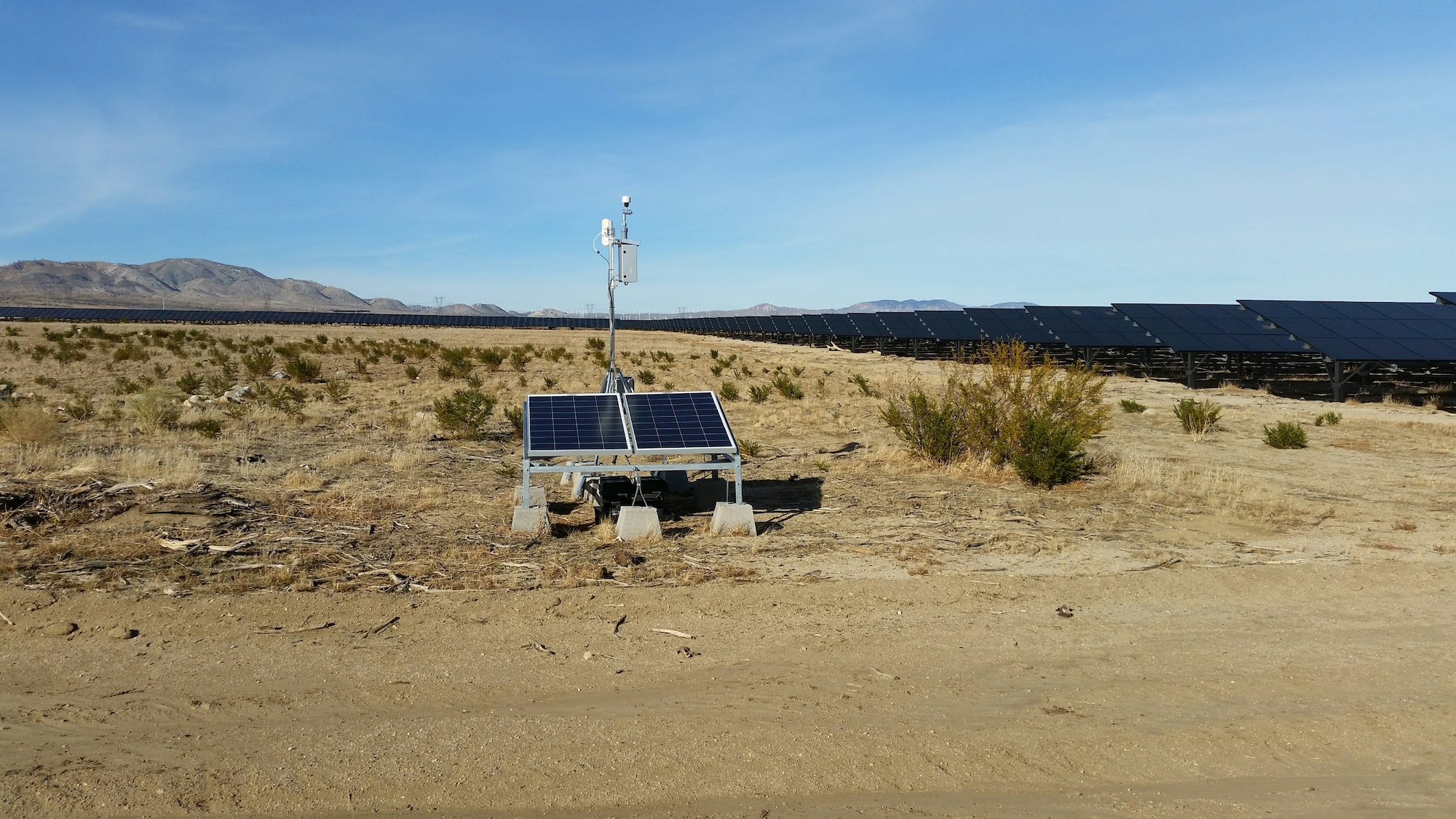 Outdoor air quality monitoring station with solar panel at a desert site